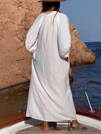 Langes, locker sitzendes Hemdkleid mit geknöpften Taschen und Puffärmeln