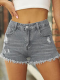 Shorts in denim elasticizzato strappati con orlo sfrangiato