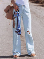 Jeans à gamba larga strappati à vita alta