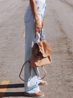 Jeans à gamba larga strappati à vita alta