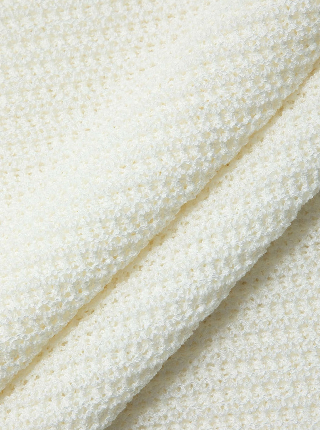 Mini abito in maglia senza schienale con vita all'uncinetto e allacciatura alla caviglia